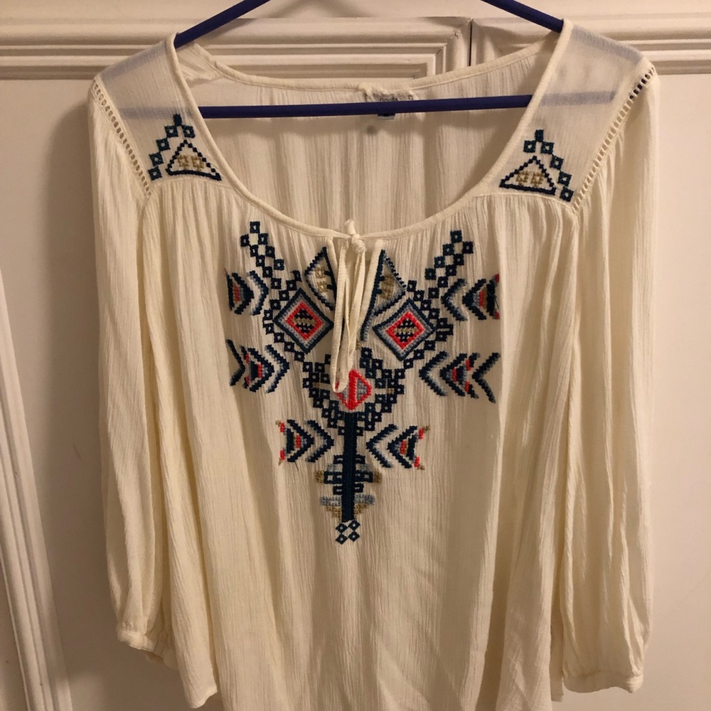 White blouse with colorful Aztec embroidery